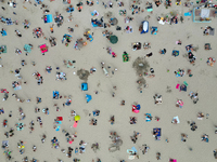 People are seen at the beach in Gdynia, Poland on August 18, 2024. (