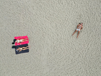 People are seen at the beach in Gdynia, Poland on August 18, 2024. (