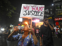 A woman is drinking water while protesting over the sexual assault and murder of a Kolkata woman doctor in Kolkata, India, on August 18, 202...