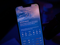 The weather application is seen showing the forecast in this illustration photo taken in Warsaw, Poland on 18 August, 2024. (