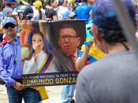 An activist is holding a banner with political phrases during a rally in downtown San Cristobal, Venezuela, on August 17, 2024. Citizens opp...