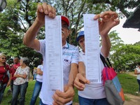 An activist is holding copies of the voting records during a rally in Los Mangos square in San Cristobal, Venezuela, on August 17, 2024. Cit...