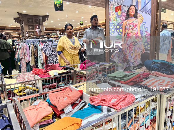 Women are shopping for designer churidars at a textile shop in Thiruvananthapuram, Kerala, India, on April 10, 2024. 