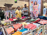 Women are shopping for designer churidars at a textile shop in Thiruvananthapuram, Kerala, India, on April 10, 2024. (