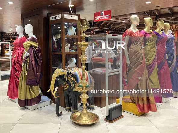 Fancy sarees are being displayed at a textile shop in Thiruvananthapuram, Kerala, India, on April 10, 2024. 