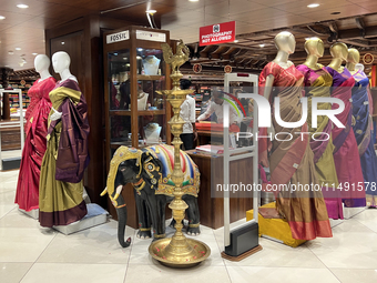 Fancy sarees are being displayed at a textile shop in Thiruvananthapuram, Kerala, India, on April 10, 2024. (