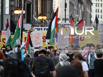 Protesters are marching in a March on the Eve of the DNC event downtown in Chicago, Illinois, United States, on August 18, 2024. Protesters...