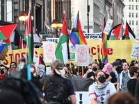 Protesters are marching in a March on the Eve of the DNC event downtown in Chicago, Illinois, United States, on August 18, 2024. Protesters...