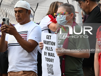 Protesters are marching in a March on the Eve of the DNC event downtown in Chicago, Illinois, United States, on August 18, 2024. Protesters...