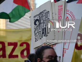 Protesters are marching in a March on the Eve of the DNC event downtown in Chicago, Illinois, United States, on August 18, 2024. Protesters...