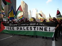 Protesters are marching in a March on the Eve of the DNC event downtown in Chicago, Illinois, United States, on August 18, 2024. Protesters...