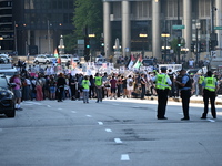 Protesters are marching in a March on the Eve of the DNC event downtown in Chicago, Illinois, United States, on August 18, 2024. Protesters...