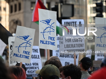 Protesters are marching in a March on the Eve of the DNC event downtown in Chicago, Illinois, United States, on August 18, 2024. Protesters...