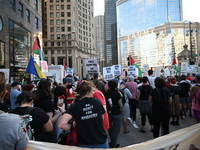 Protesters are marching in a March on the Eve of the DNC event downtown in Chicago, Illinois, United States, on August 18, 2024. Protesters...