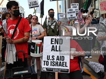 Protesters are marching in a March on the Eve of the DNC event downtown in Chicago, Illinois, United States, on August 18, 2024. Protesters...