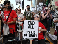 Protesters are marching in a March on the Eve of the DNC event downtown in Chicago, Illinois, United States, on August 18, 2024. Protesters...