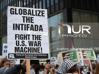 Protesters are marching in a March on the Eve of the DNC event downtown in Chicago, Illinois, United States, on August 18, 2024. Protesters...