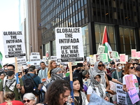 Protesters are marching in a March on the Eve of the DNC event downtown in Chicago, Illinois, United States, on August 18, 2024. Protesters...