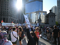 Protesters are marching in a March on the Eve of the DNC event downtown in Chicago, Illinois, United States, on August 18, 2024. Protesters...