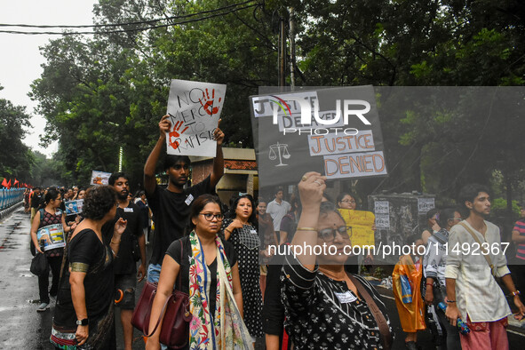 People are participating in a protest rally against the rape and murder of a second-year PGD Doctor at RG Kar Medical College, in Kolkata, I...