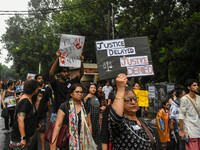 People are participating in a protest rally against the rape and murder of a second-year PGD Doctor at RG Kar Medical College, in Kolkata, I...