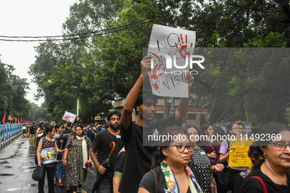 People are participating in a protest rally against the rape and murder of a second-year PGD Doctor at RG Kar Medical College, in Kolkata, I...