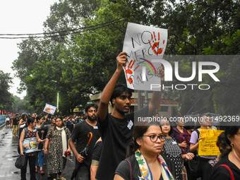 People are participating in a protest rally against the rape and murder of a second-year PGD Doctor at RG Kar Medical College, in Kolkata, I...