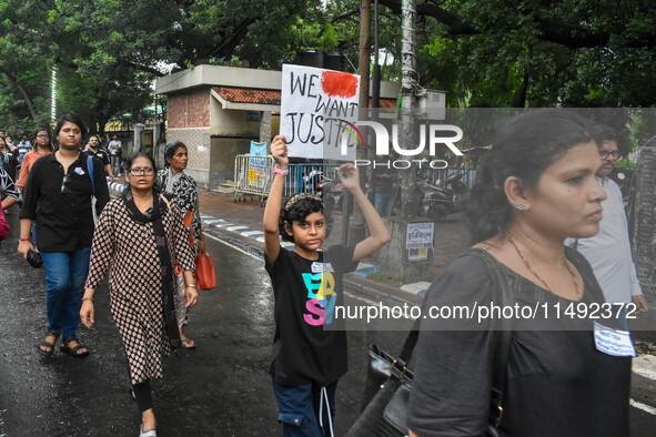 People are participating in a protest rally against the rape and murder of a second-year PGD Doctor at RG Kar Medical College, in Kolkata, I...