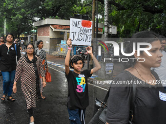 People are participating in a protest rally against the rape and murder of a second-year PGD Doctor at RG Kar Medical College, in Kolkata, I...