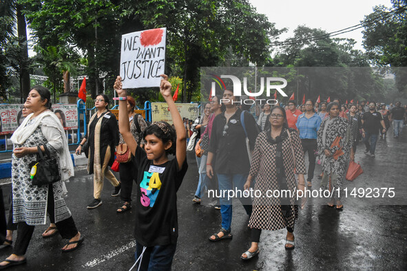 People are participating in a protest rally against the rape and murder of a second-year PGD Doctor at RG Kar Medical College, in Kolkata, I...