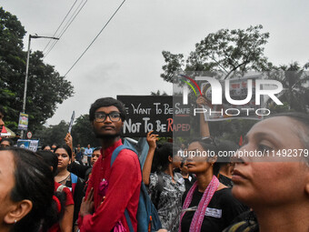 People are participating in a protest rally against the rape and murder of a second-year PGD Doctor at RG Kar Medical College, in Kolkata, I...