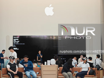 Customers are trying Apple Vision Pro at the largest Apple store in Asia in Shanghai, China, on August 19, 2024. (