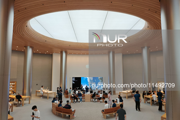 Customers are trying Apple Vision Pro at the largest Apple store in Asia in Shanghai, China, on August 19, 2024. 