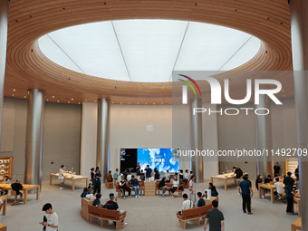 Customers are trying Apple Vision Pro at the largest Apple store in Asia in Shanghai, China, on August 19, 2024. (