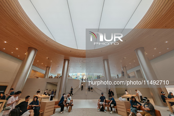 Customers are trying Apple Vision Pro at the largest Apple store in Asia in Shanghai, China, on August 19, 2024. 