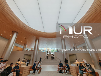 Customers are trying Apple Vision Pro at the largest Apple store in Asia in Shanghai, China, on August 19, 2024. (