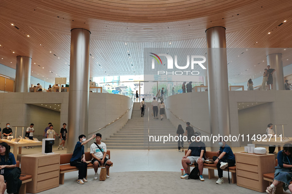 Customers are trying Apple Vision Pro at the largest Apple store in Asia in Shanghai, China, on August 19, 2024. 