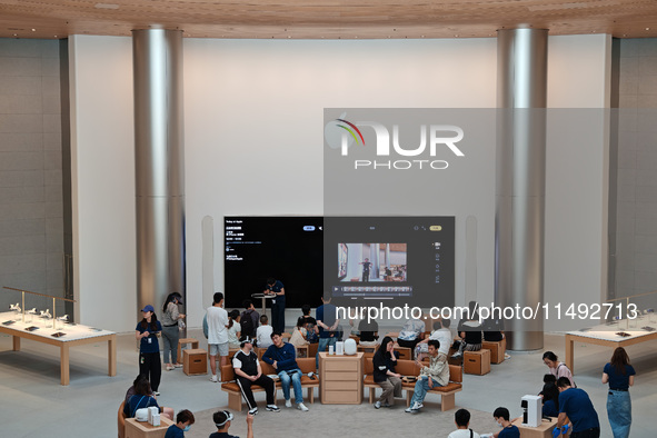 Customers are trying Apple Vision Pro at the largest Apple store in Asia in Shanghai, China, on August 19, 2024. 