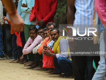 Hindu devotees are waiting in a long queue to pay their obeisance on the occasion of the Raksha Bandhan festival at the Shankaracharya templ...