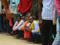 Hindu devotees are waiting in a long queue to pay their obeisance on the occasion of the Raksha Bandhan festival at the Shankaracharya templ...