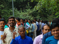 Hindu devotees are waiting in a long queue to pay their obeisance on the occasion of the Raksha Bandhan festival at the Shankaracharya templ...