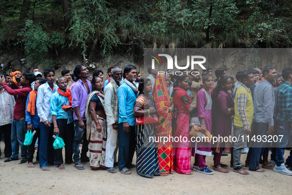 Hindu devotees are waiting in a long queue to pay their obeisance on the occasion of the Raksha Bandhan festival at the Shankaracharya templ...