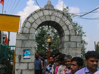 A Hindu devotee is ringing a traditional bell on the occasion of the Raksha Bandhan festival at the Shankaracharya temple in Srinagar, Jammu...