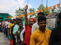 Hindu devotees are waiting in a long queue to pay their obeisance on the occasion of the Raksha Bandhan festival at the Shankaracharya templ...