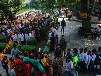 Hindu devotees are waiting in a long queue to pay their obeisance on the occasion of the Raksha Bandhan festival at the Shankaracharya templ...