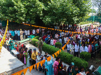 Hindu devotees are waiting in a long queue to pay their obeisance on the occasion of the Raksha Bandhan festival at the Shankaracharya templ...