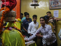 Hindu devotees are paying their obeisance on the occasion of the Raksha Bandhan festival at the Shankaracharya temple in Srinagar, Jammu and...