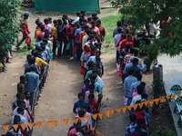 Hindu devotees are waiting in a long queue to pay their obeisance on the occasion of the Raksha Bandhan festival at the Shankaracharya templ...