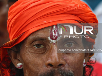 A Hindu devotee is arriving to pay obeisance on the occasion of the Raksha Bandhan festival at the Shankaracharya temple in Srinagar, Jammu...