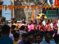 Hindu devotees are waiting in a long queue to pay their obeisance on the occasion of the Raksha Bandhan festival at the Shankaracharya templ...